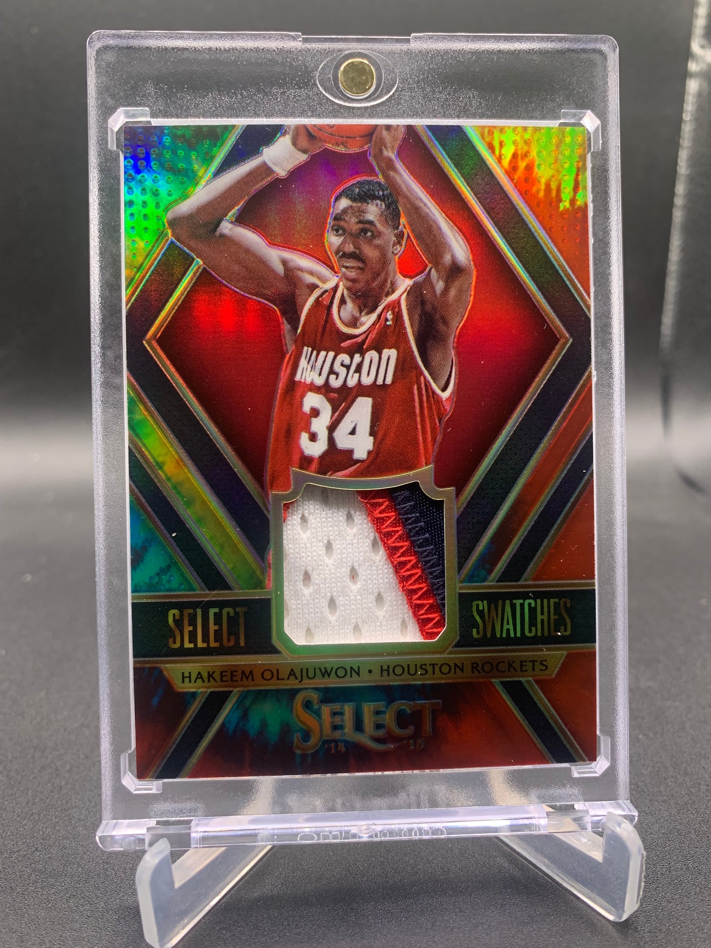 2014-15 Panini Select Basketball - Hakeem Olajuwon ‘Select Swatches’ Tie Dye /25 *Game-Worn Patch*